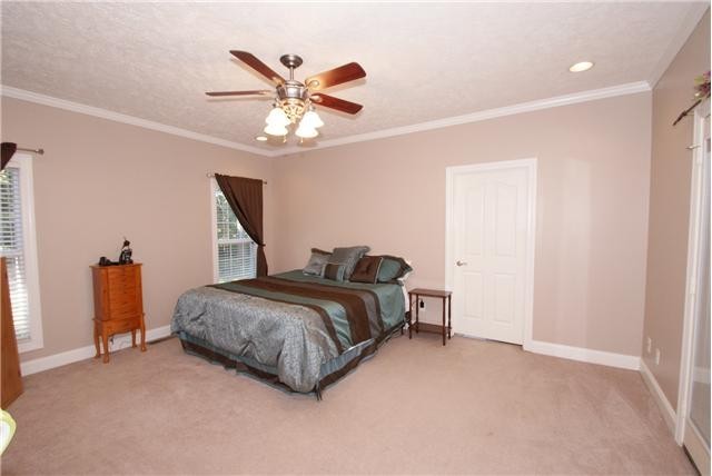 83 Rutledge Falls Road Tullahoma, TN 37388 - Photo 17 of 25 a bedroom with a bed and a chandelier