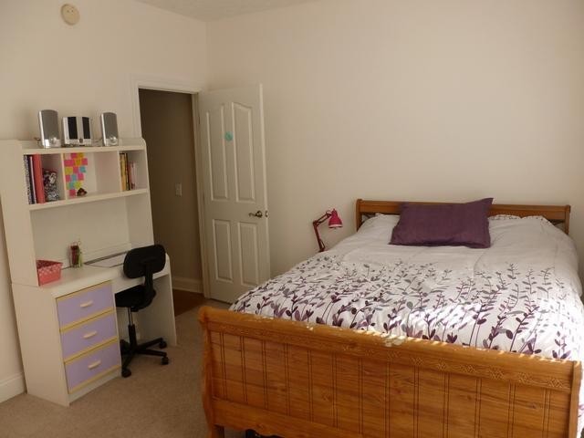 83 Rutledge Falls Road Tullahoma, TN 37388 - Photo 19 of 25 a bedroom with a bed and a desk