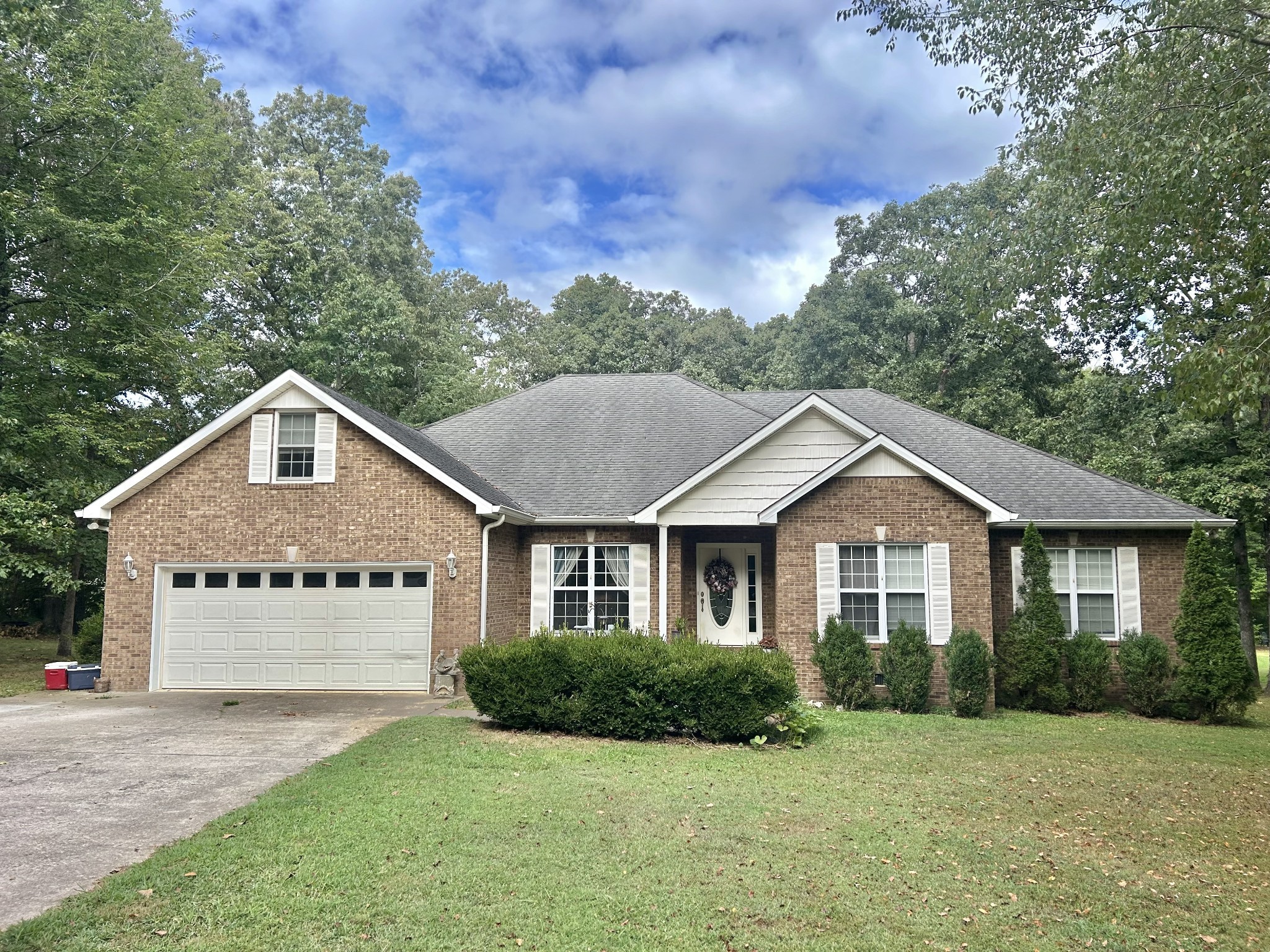 83 Rutledge Falls Road Tullahoma, TN 37388 - Photo 2 of 25 a front view of a house with a yard