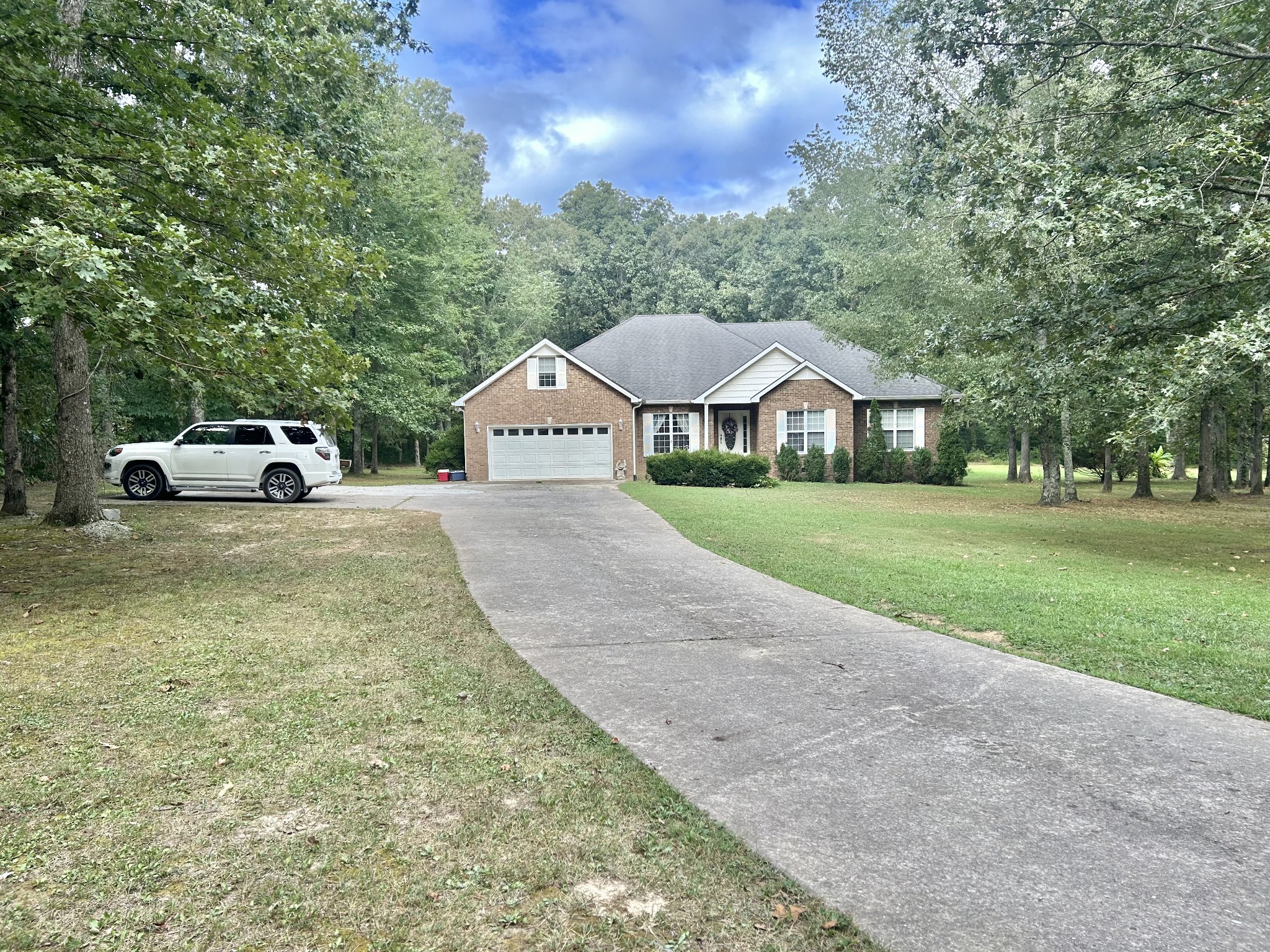 83 Rutledge Falls Road Tullahoma, TN 37388 - Photo 4 of 25 a front view of a house with a yard