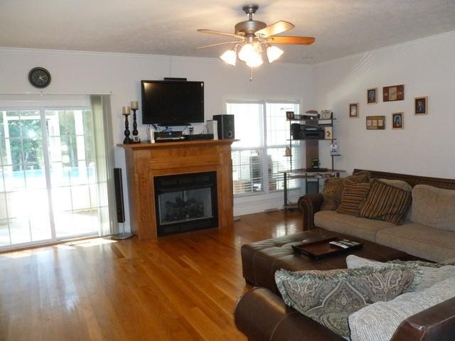 83 Rutledge Falls Road Tullahoma, TN 37388 - Photo 8 of 25 a living room with furniture a fireplace and a flat screen tv