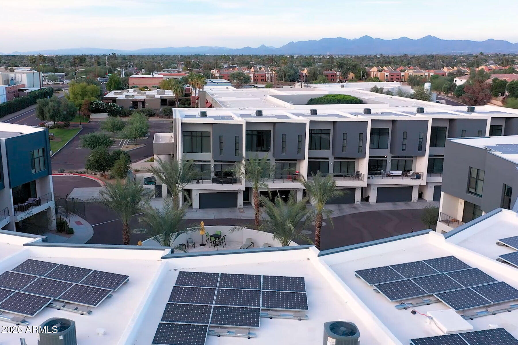 1401 North Granite Reef Road, Unit 1019 Scottsdale, AZ 85257 - Photo 5 of 6 a view of a house with pool and sitting area