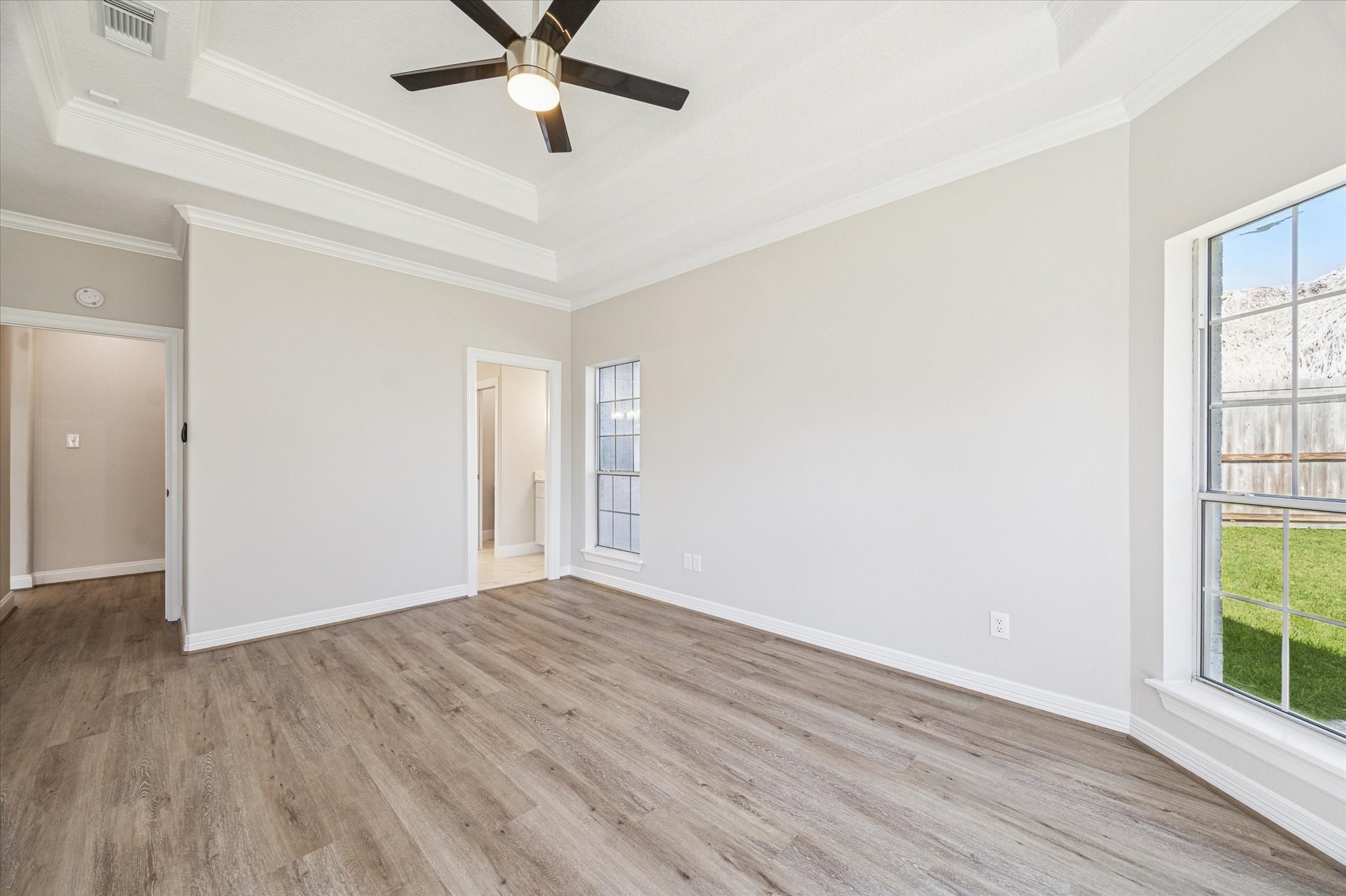 5437 Edgewater Court Willis, TX 77318 - Photo 14 of 29 wooden floor in an empty room with a window