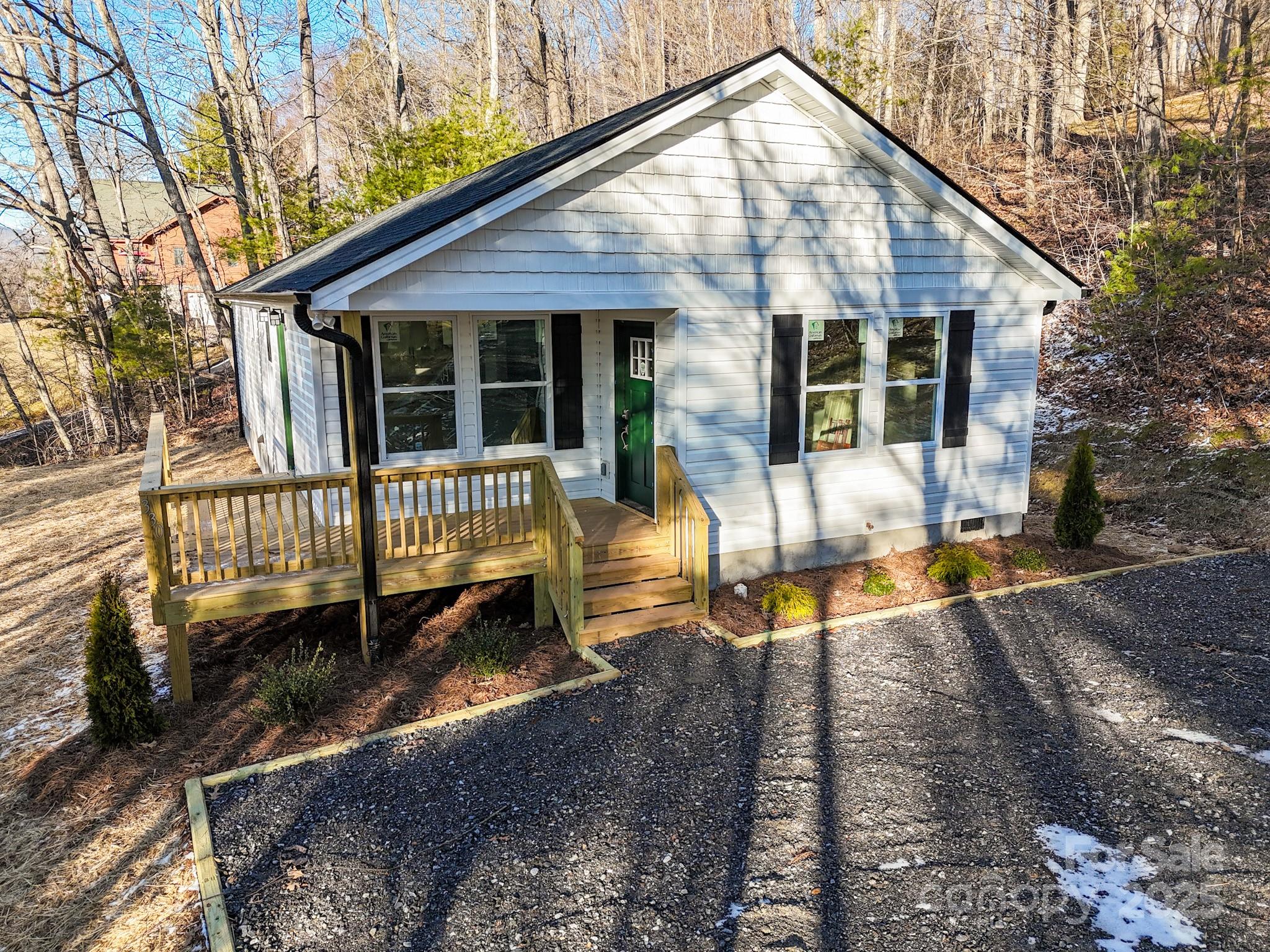 330 Peaceful Lane Clyde, NC 28721 - Photo 34 of 39 a view of a house with backyard and sitting area