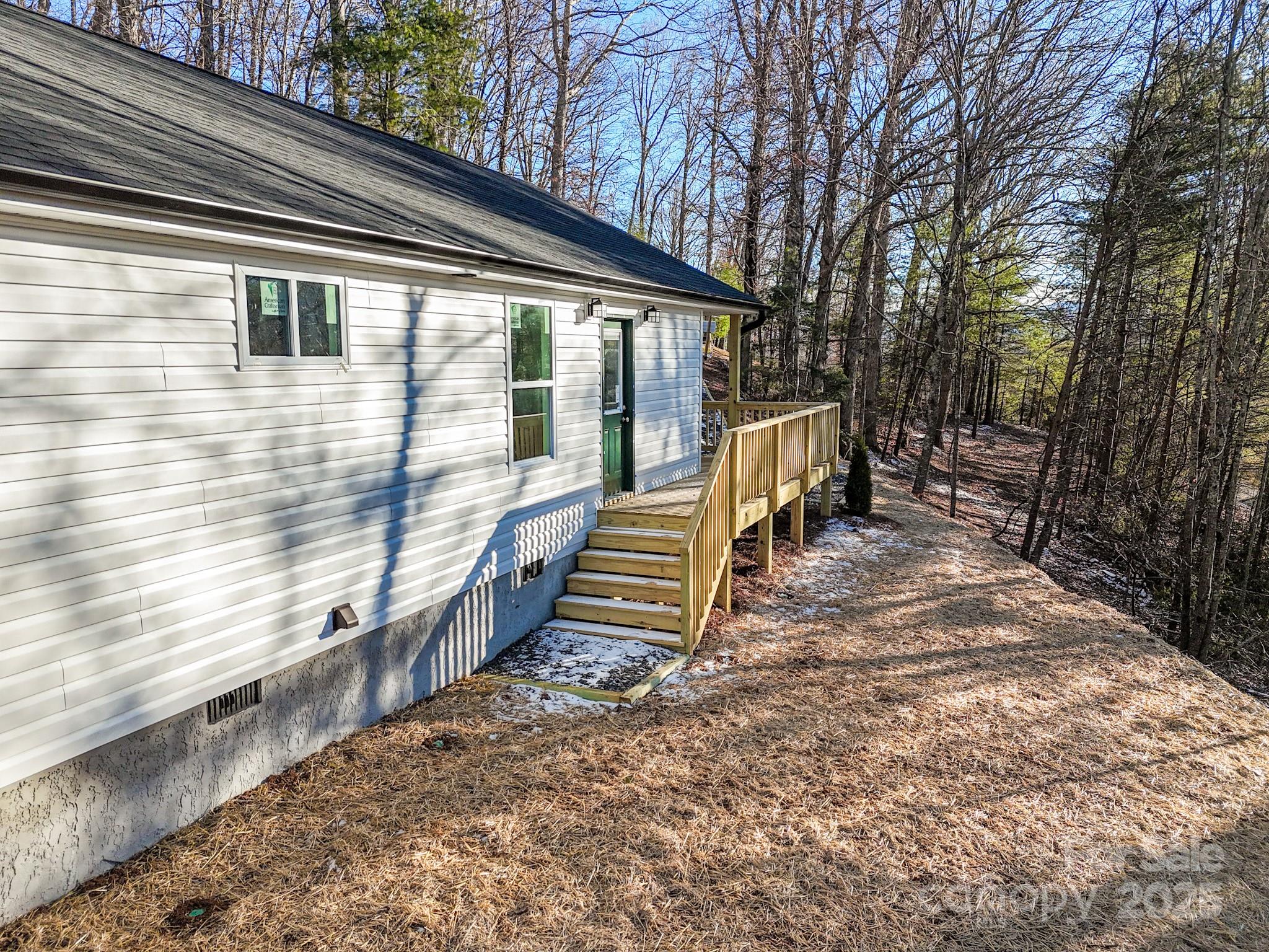 330 Peaceful Lane Clyde, NC 28721 - Photo 37 of 39 a view of wooden house with a yard
