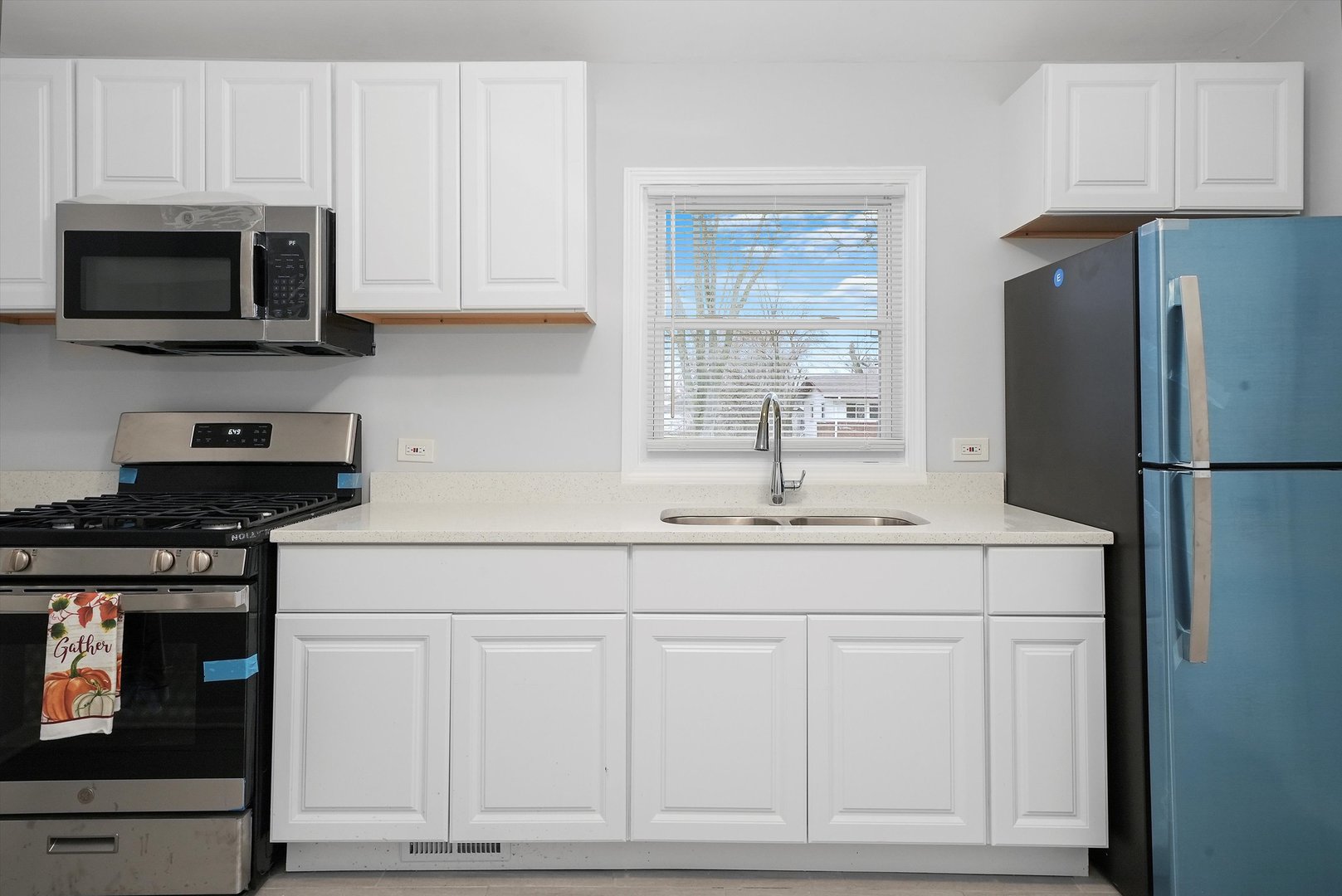 3334 Heather Drive Markham, IL 60428 - Photo 3 of 36 a kitchen with white cabinets and stainless steel appliances