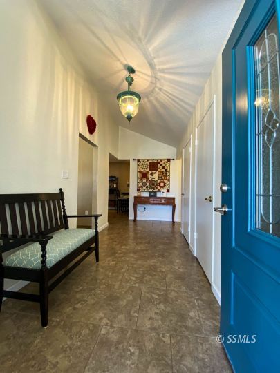 218 South Lilac Street Ridgecrest, CA 93555 - Photo 4 of 43 a living room with furniture and a chandelier