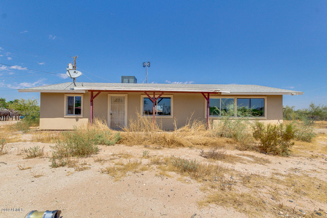 20632 West Telegram Path Road Buckeye, AZ 85326 - Photo 1 of 23 a front view of a house with a yard