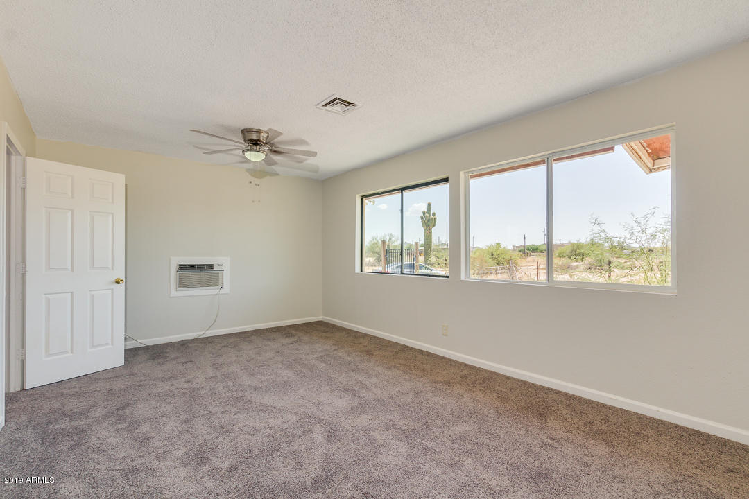20632 West Telegram Path Road Buckeye, AZ 85326 - Photo 13 of 23 a view of an empty room with a window
