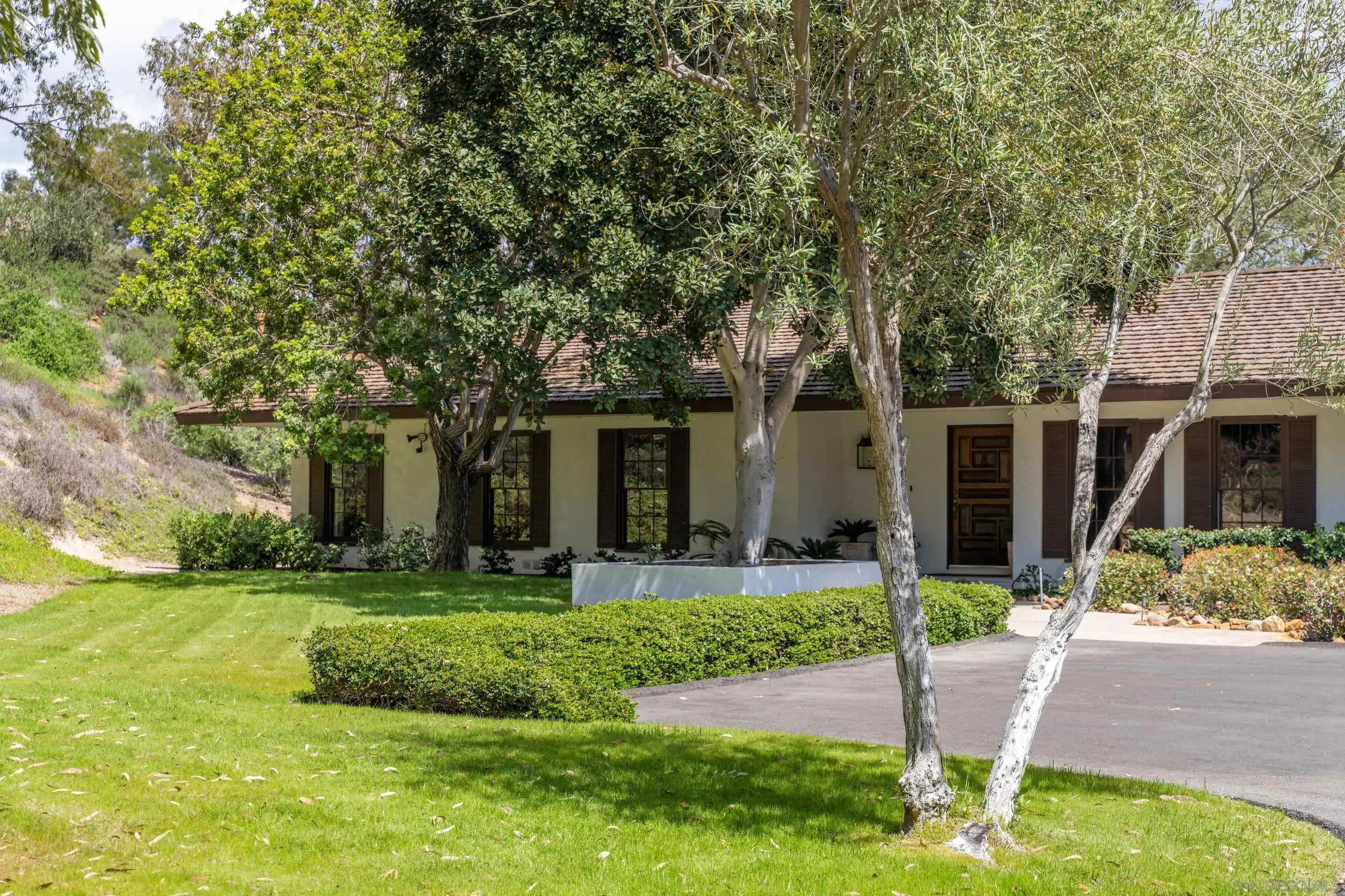 16059 Puerta Del Sol Rancho Santa Fe, CA 92067 - Photo 24 of 25 a front view of house with yard and green space