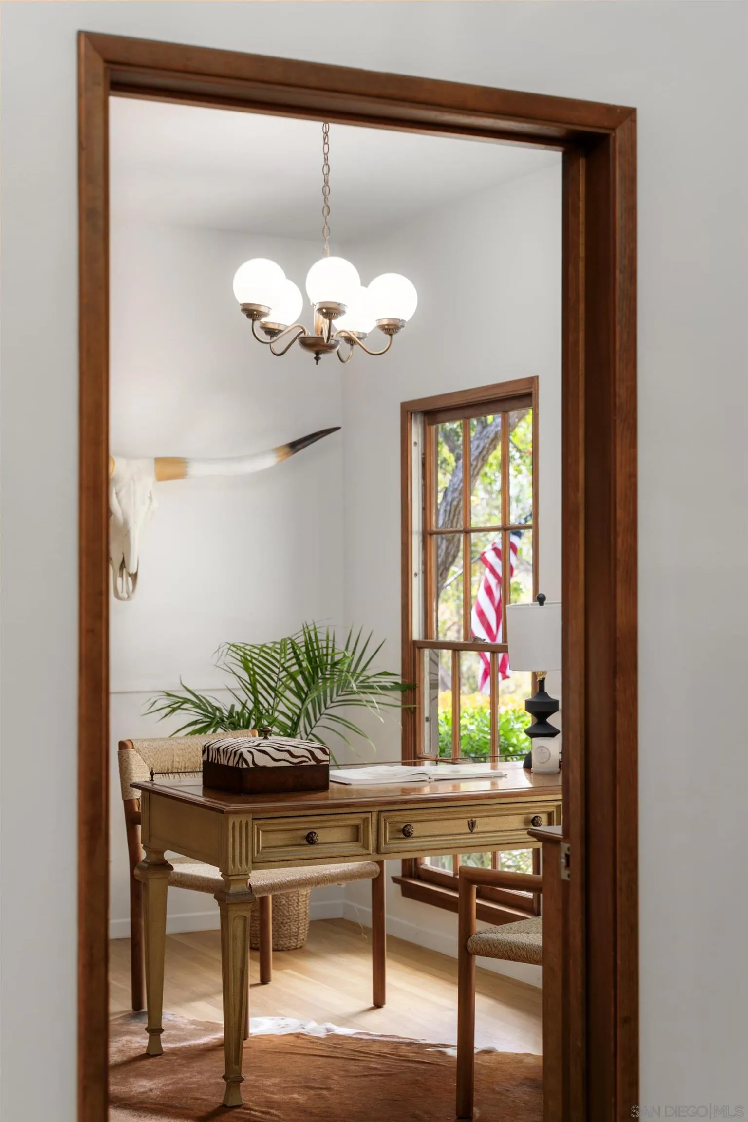 16059 Puerta Del Sol Rancho Santa Fe, CA 92067 - Photo 4 of 25 a view of a dining room with furniture a chandelier and a window