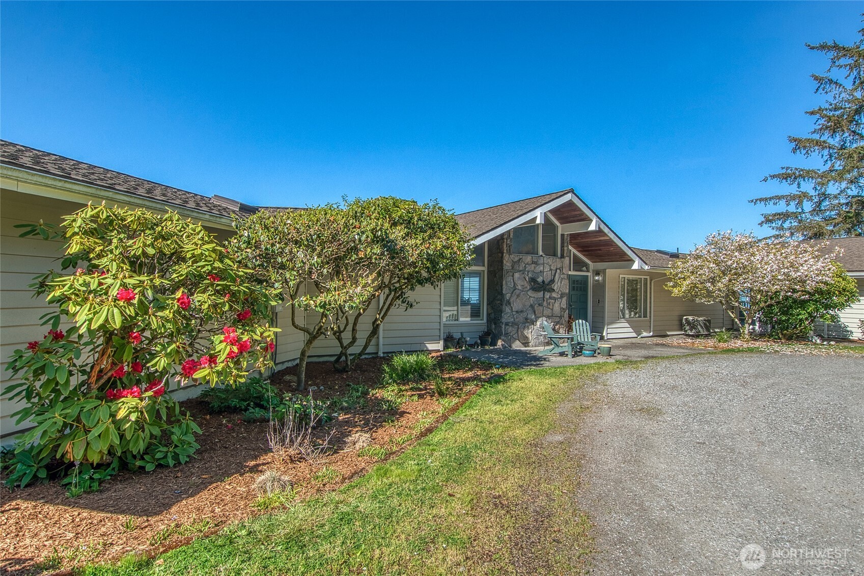 664 Tidewinds Lane Orcas Island, WA 98245 - Photo 14 of 35 a front view of a house with a yard