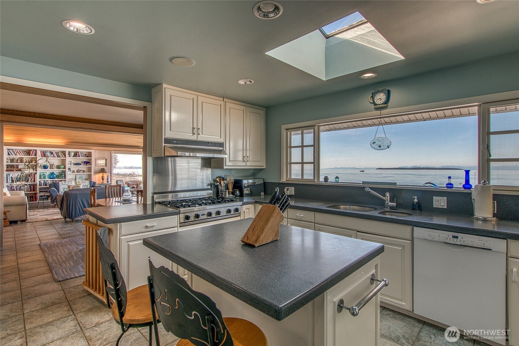 664 Tidewinds Lane Orcas Island, WA 98245 - Photo 16 of 35 a kitchen with a sink a counter and chairs