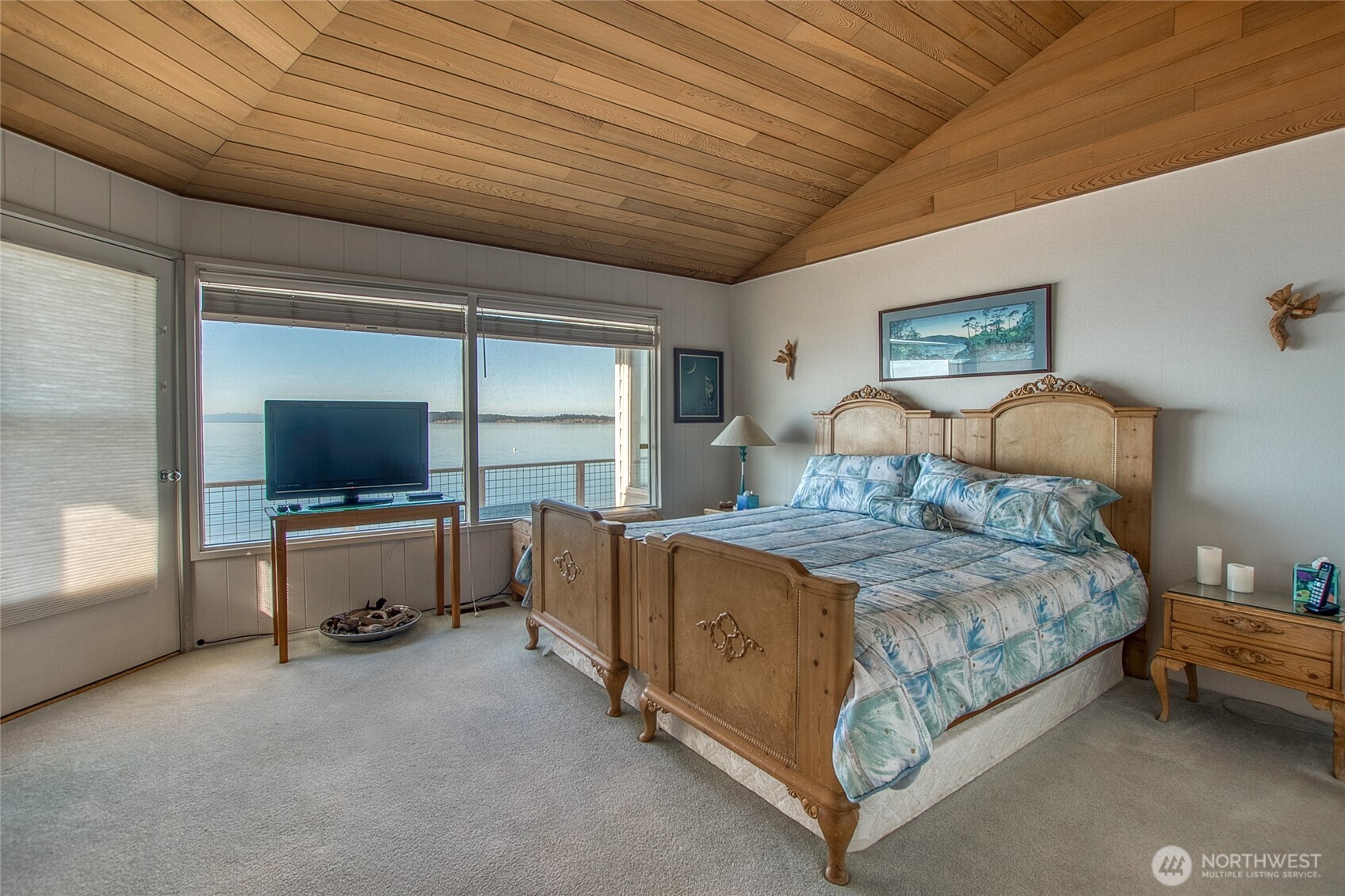 664 Tidewinds Lane Orcas Island, WA 98245 - Photo 18 of 35 a bedroom with a bed and large window