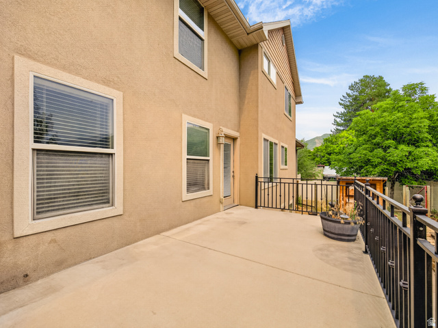 1279 West 1500th Street North Mapleton, UT 84664 - Photo 68 of 83 Expansive concrete patio bordered by black metal railings