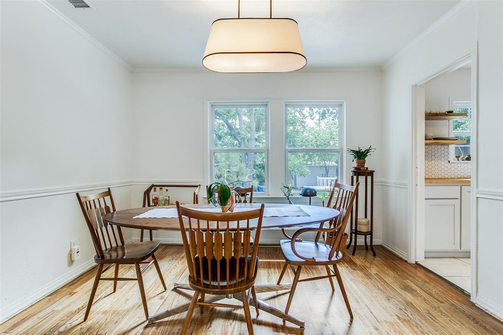 8619 Angora Street Dallas, TX 75218 - Photo 6 of 24 Dining room with light hardwood / wood-style floors and crown molding