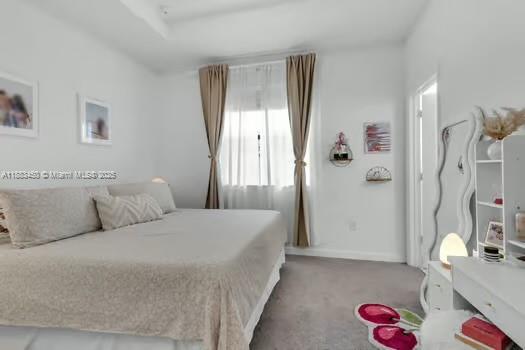 11852 Southwest 245 Terrace Homestead, FL 33032 - Photo 14 of 31 a bedroom with a bed and a chandelier