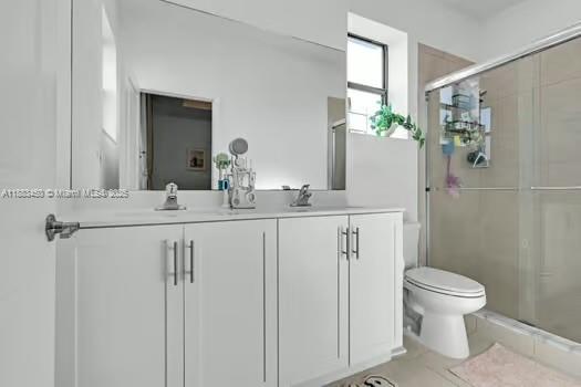 11852 Southwest 245 Terrace Homestead, FL 33032 - Photo 15 of 31 a bathroom with a sink toilet and shower