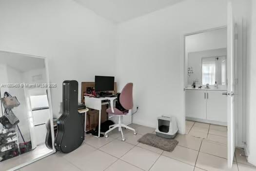 11852 Southwest 245 Terrace Homestead, FL 33032 - Photo 17 of 31 a view of a workspace with furniture and a window