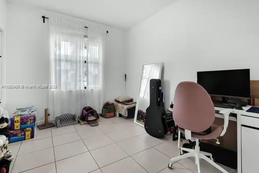 11852 Southwest 245 Terrace Homestead, FL 33032 - Photo 20 of 31 a view of a workspace with furniture and a window
