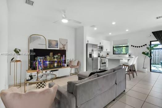 11852 Southwest 245 Terrace Homestead, FL 33032 - Photo 4 of 31 a living room with fireplace furniture and a flat screen tv