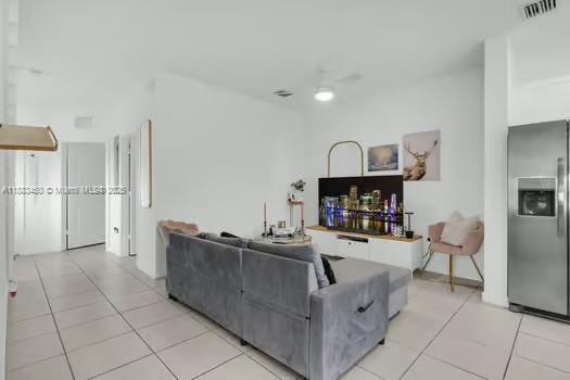 11852 Southwest 245 Terrace Homestead, FL 33032 - Photo 5 of 31 a living room with furniture and a fireplace