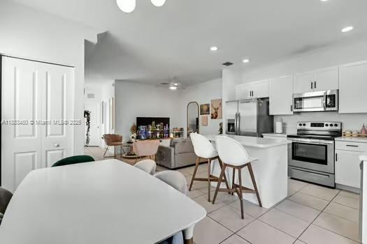 11852 Southwest 245 Terrace Homestead, FL 33032 - Photo 6 of 31 a large white kitchen with stainless steel appliances