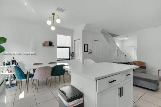 11852 Southwest 245 Terrace Homestead, FL 33032 - Photo 8 of 31 a room with a table chairs and a stove