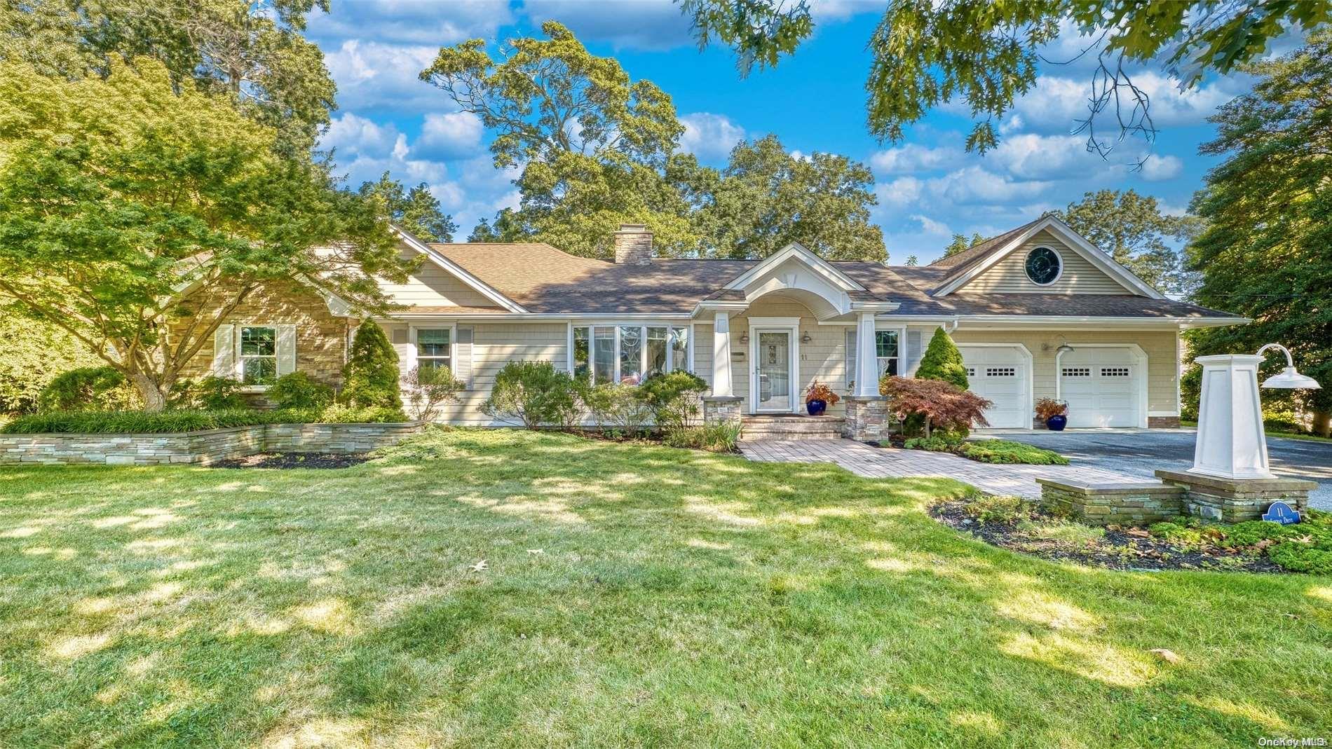 11 Shebar Drive Islip, NY 11751 - Photo 1 of 1 a front view of a house with a garden