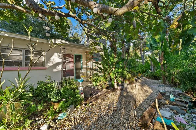 an aerial view of a house with yard