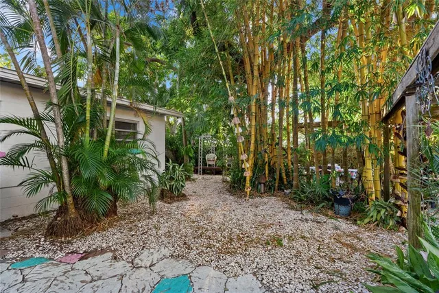 a backyard of a house with lots of green space