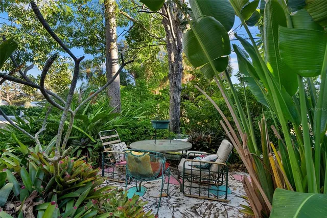 a view of backyard with sitting area