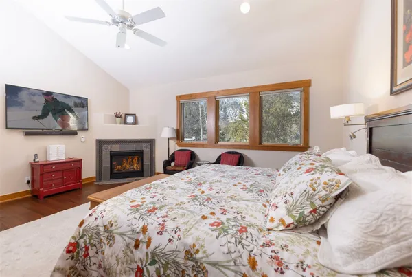 a bedroom with a bed and a fireplace