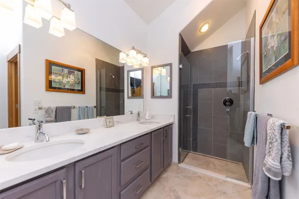 a bathroom with a double vanity sink mirror and double