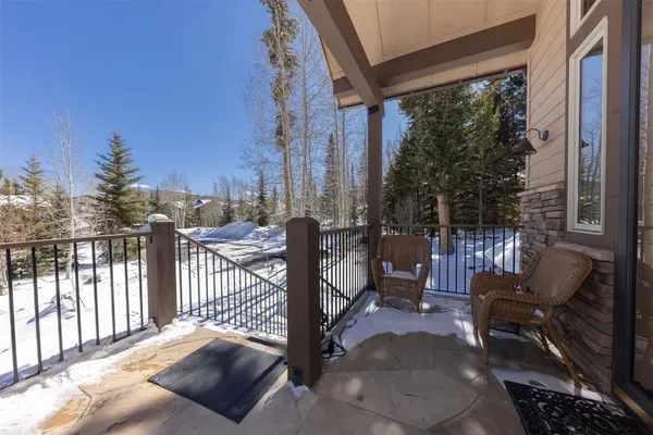 a view of two chairs in the balcony