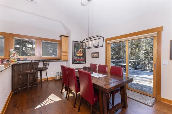 a living room with furniture a table and a large window
