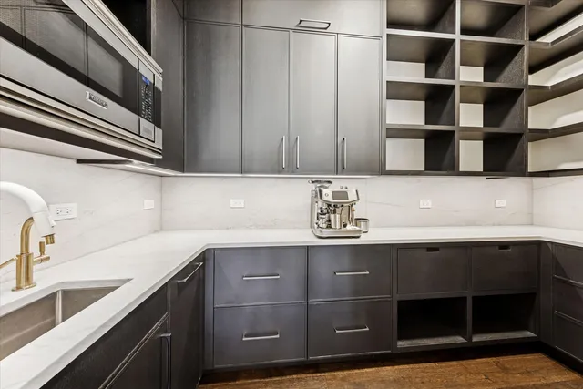 a kitchen with a sink and cabinets