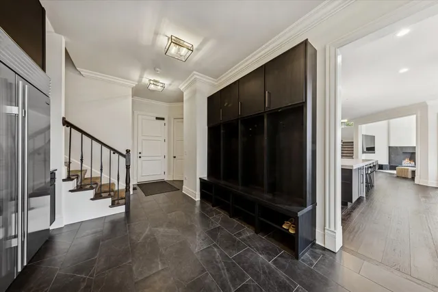a view of hallway with stairs and a couch