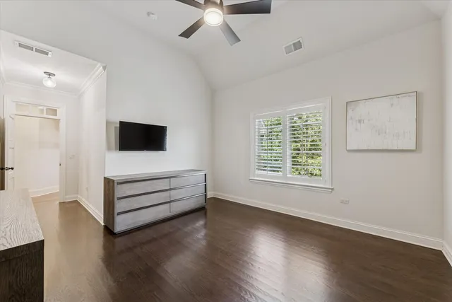 a view of workspace with wooden floor and ceiling fan