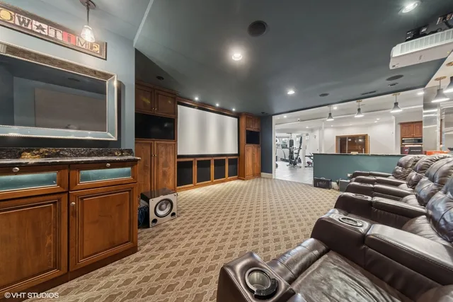 a bedroom with furniture and a flat screen tv