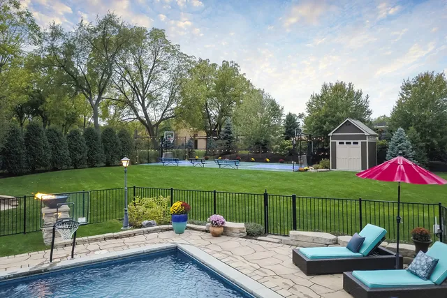 a view of a table and chairs under an umbrella