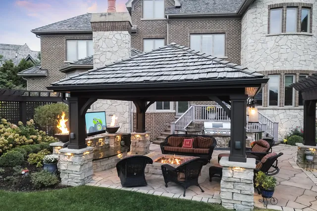 a backyard of a house with outdoor seating
