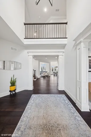 a view of a living room and a wooden floor