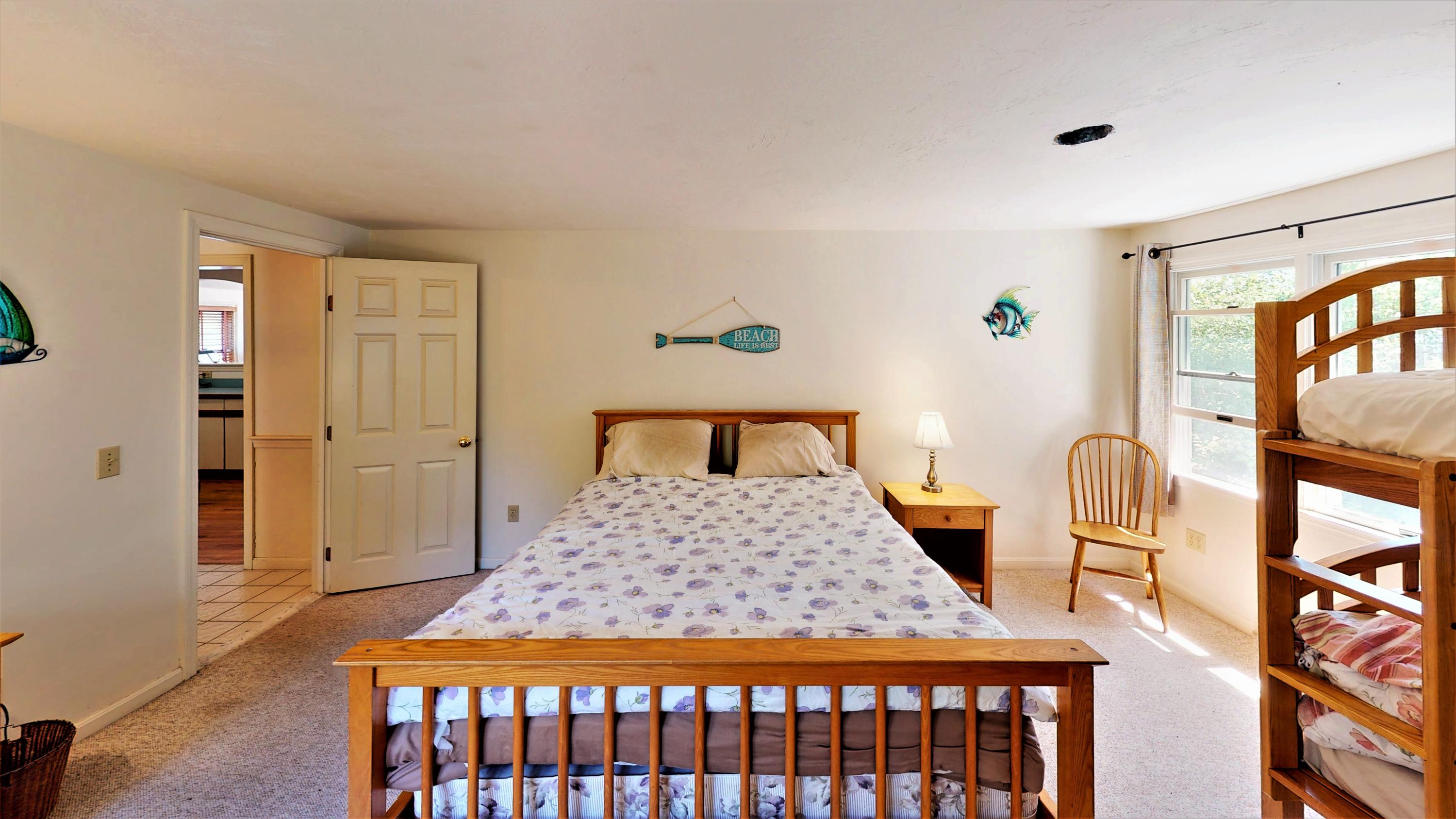 110 Annable Point Road Centerville, MA 02632 - Photo 23 of 27 a bedroom with a bed and wooden floor