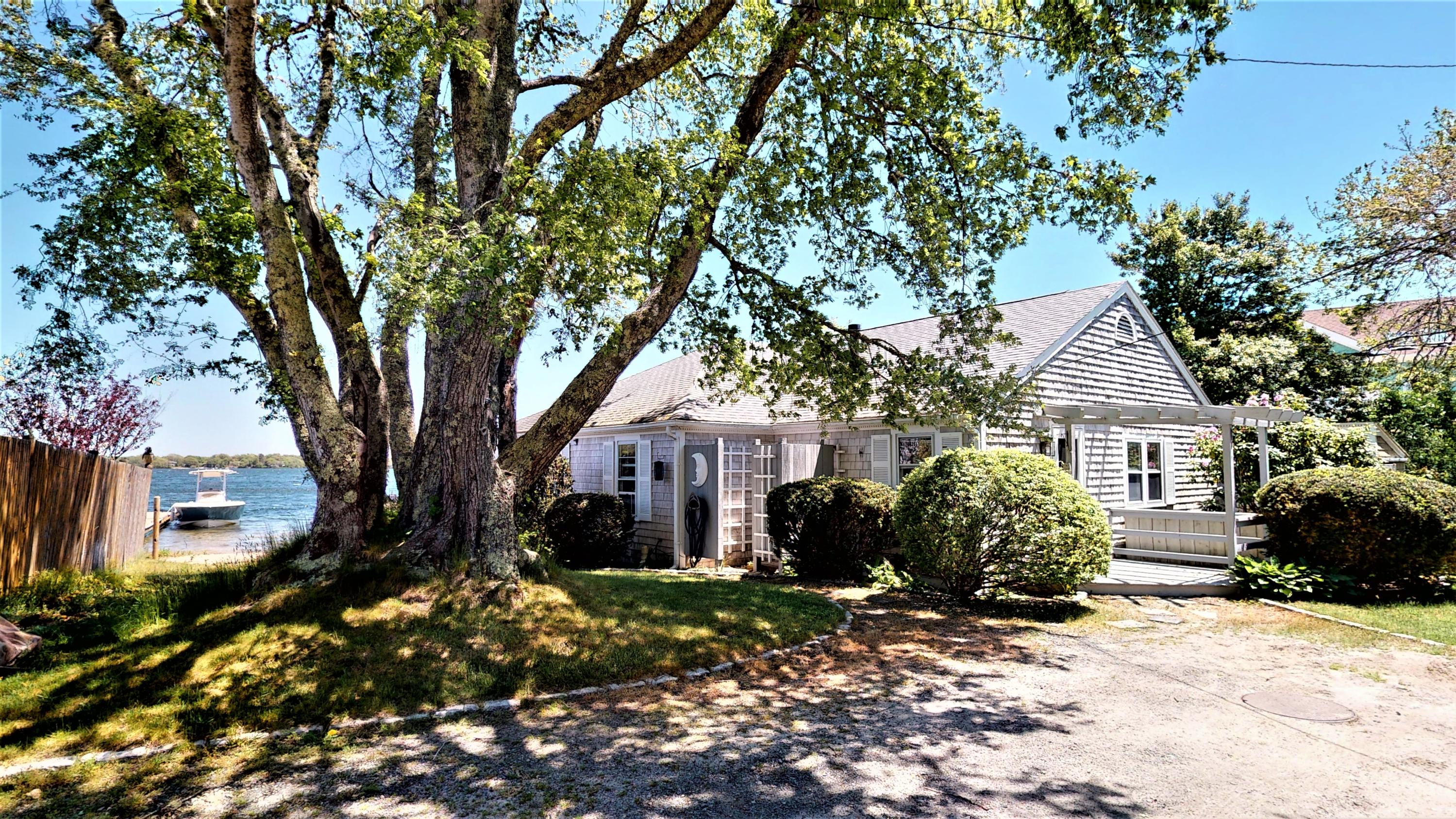 110 Annable Point Road Centerville, MA 02632 - Photo 9 of 27 a front view of a house with a garden