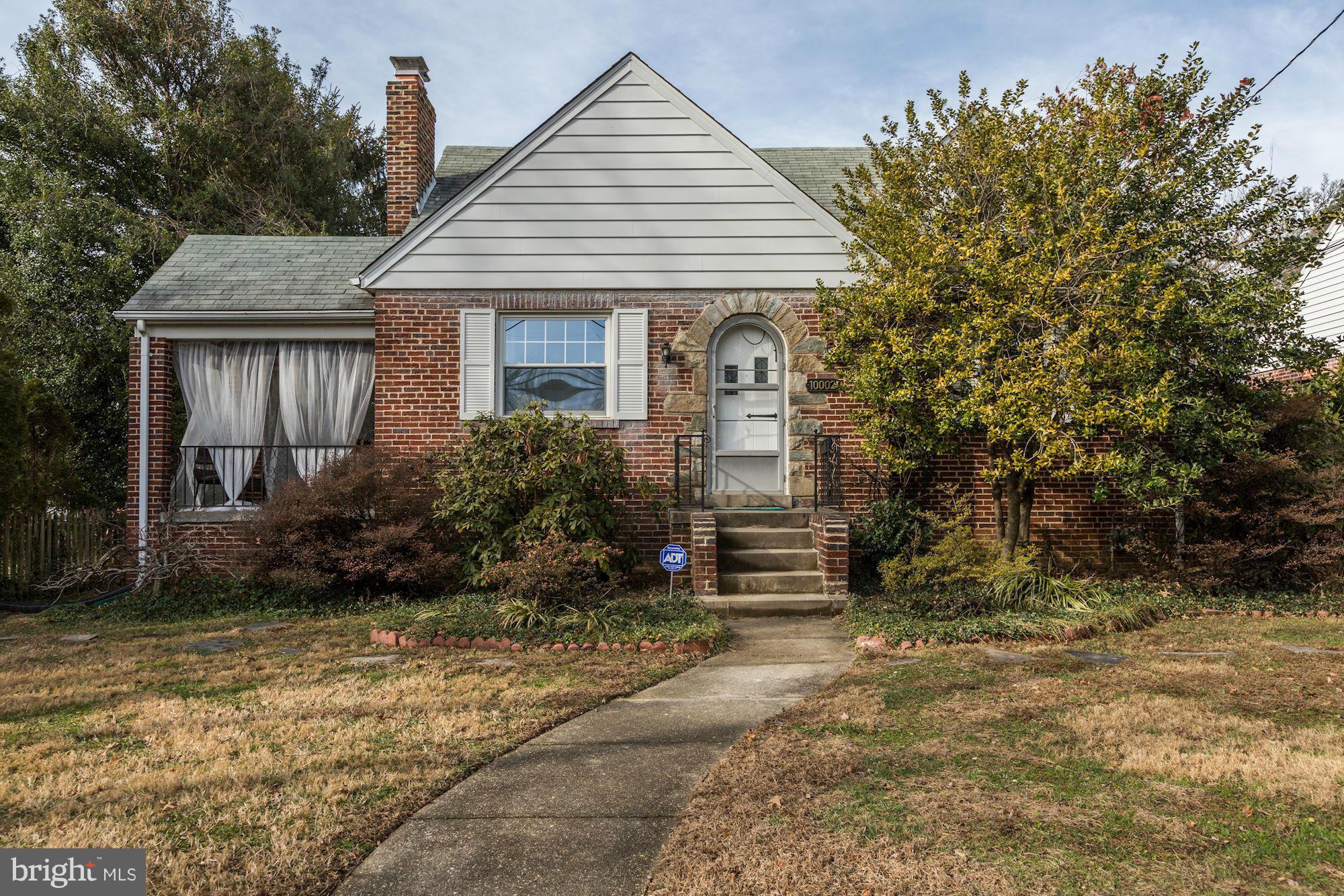 10002 Rogart Road Silver Spring, MD 20901 - Photo 1 of 28 a front view of a house with a yard