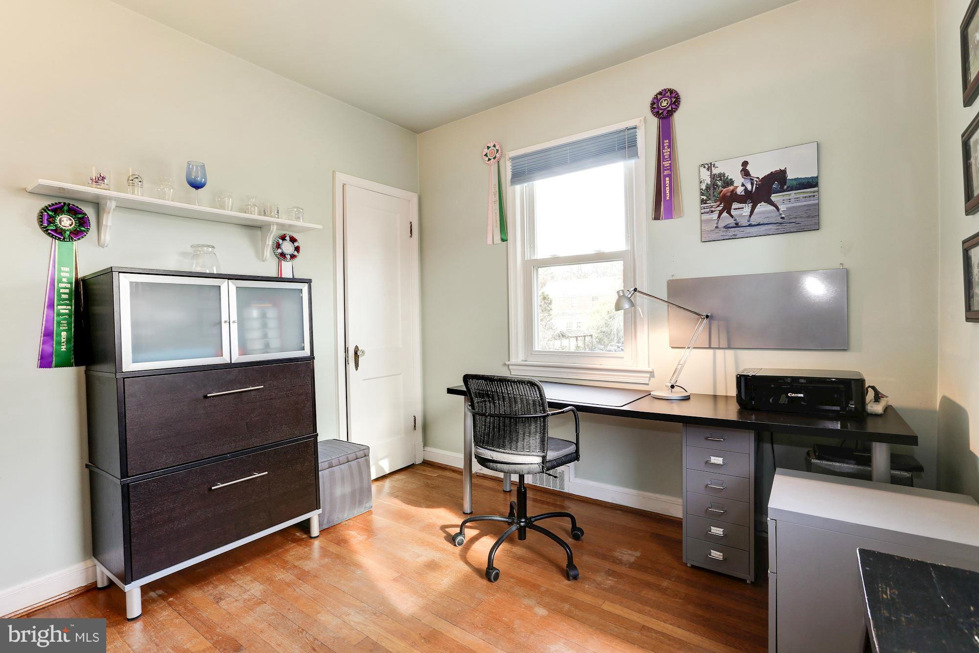 10002 Rogart Road Silver Spring, MD 20901 - Photo 12 of 28 a view of a workspace with furniture and a window