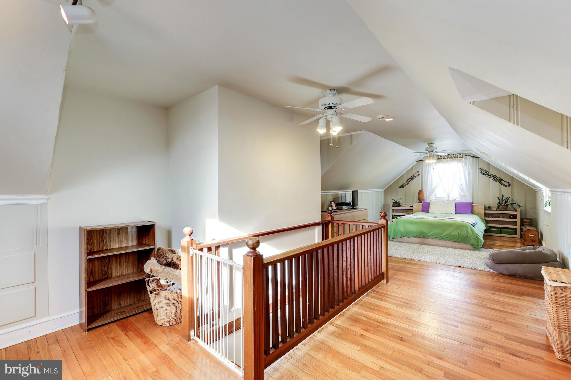 10002 Rogart Road Silver Spring, MD 20901 - Photo 15 of 28 a view of entryway and hall with wooden floor