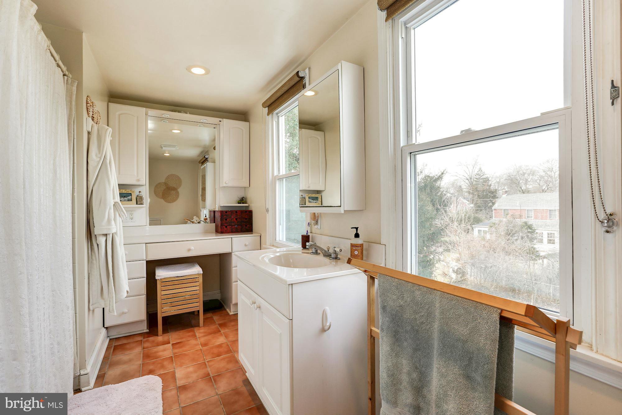 10002 Rogart Road Silver Spring, MD 20901 - Photo 18 of 28 a bathroom with a sink and a mirror