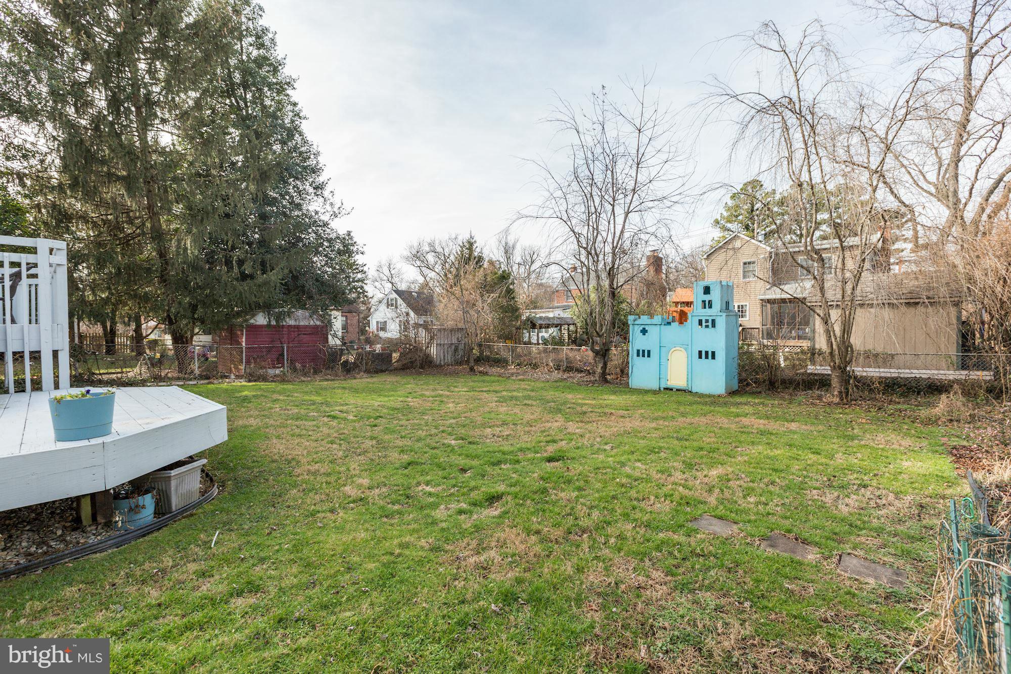 10002 Rogart Road Silver Spring, MD 20901 - Photo 26 of 28 a swimming pool with outdoor seating and yard